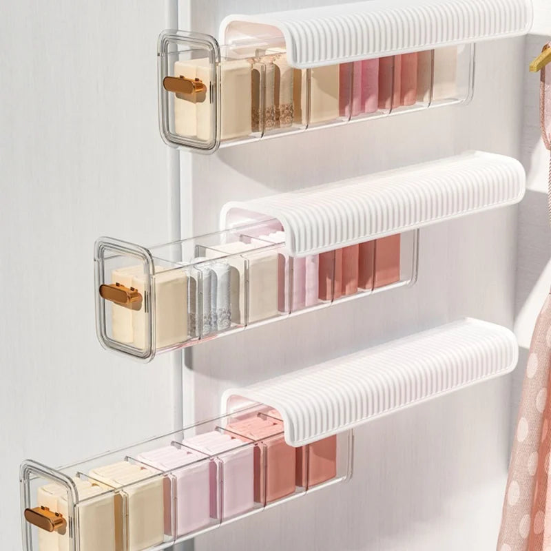 Wall-mounted laundry organizer with compartments, retractable