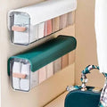 Wall-mounted laundry organizer with compartments, retractable