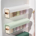 Wall-mounted laundry organizer with compartments, retractable