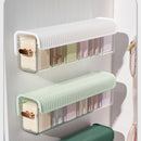 Wall-mounted laundry organizer with compartments, retractable
